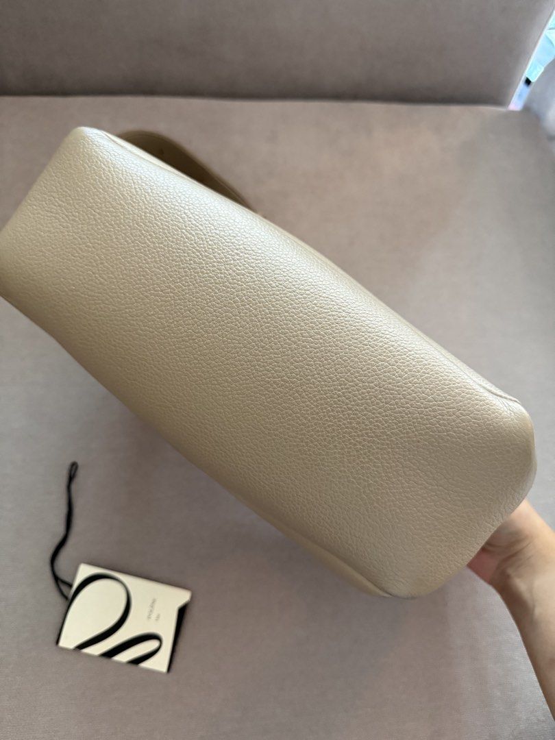 Polene Umi Bag - Taupe (Category: Luxury Bags & Wallets) located in Quezon City. Submitted by shop_for_less (Listing ID 1447520445, Image 3). Description: Selling my Polène Umi, purchased online in 2023 for around ₱27,000. Details: * Discontinued model * Thick, premium leather with beautiful quality * Very roomy and fits daily essentials * Can be worn as a shoulder bag or adjusted into a crossbody * Gold hardware is still in excellent condition *