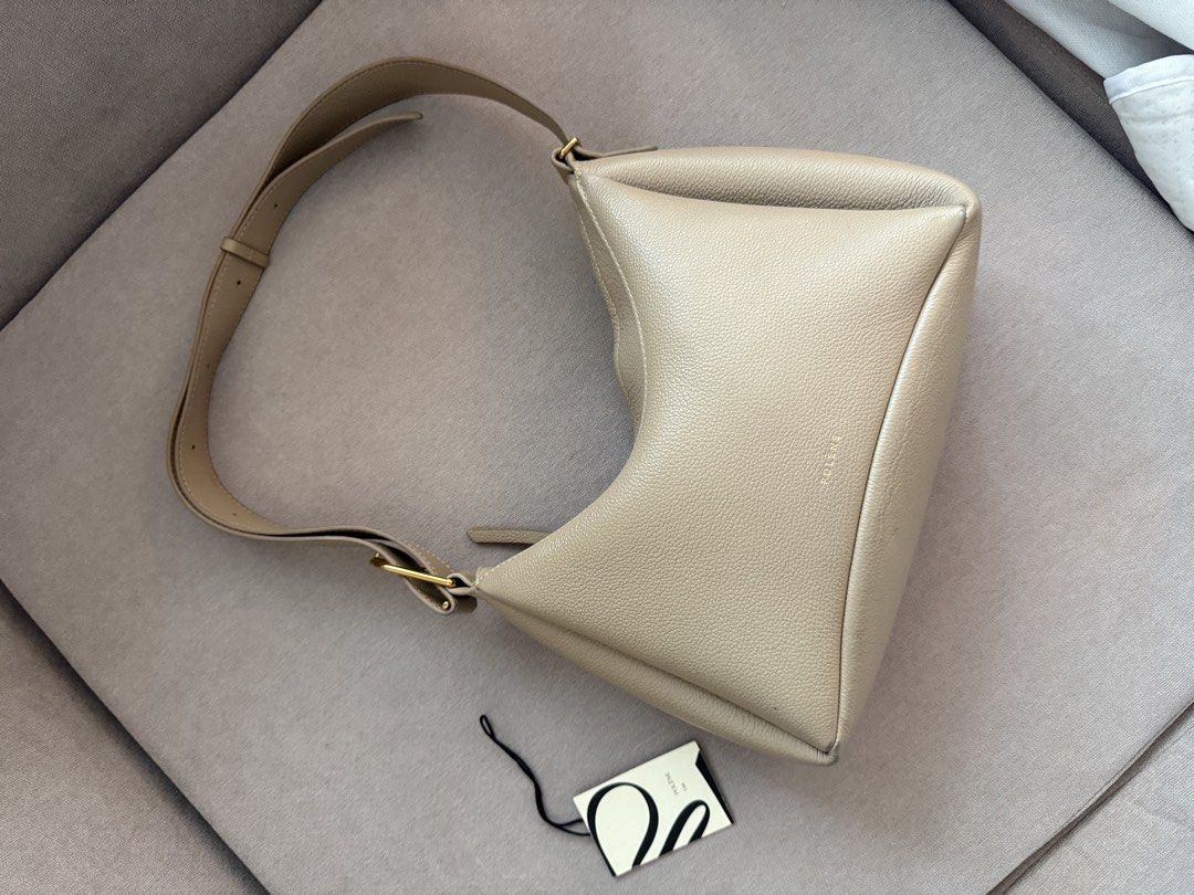 Polene Umi Bag - Taupe (Category: Luxury Bags & Wallets) located in Quezon City. Submitted by shop_for_less (Listing ID 1447520445, Image 2). Description: Selling my Polène Umi, purchased online in 2023 for around ₱27,000. Details: * Discontinued model * Thick, premium leather with beautiful quality * Very roomy and fits daily essentials * Can be worn as a shoulder bag or adjusted into a crossbody * Gold hardware is still in excellent condition *