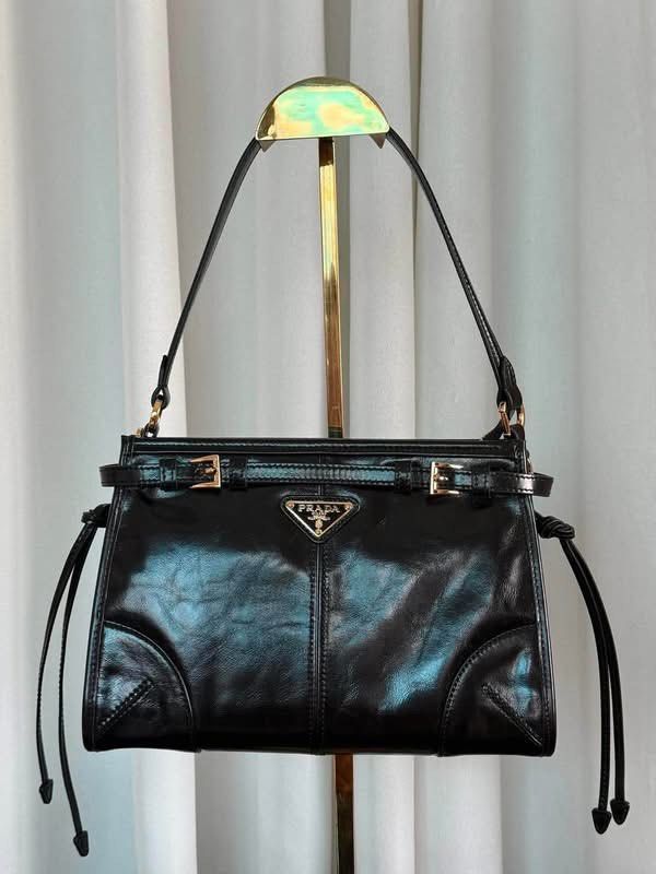 Preloved Prada Shoulder Bag (Category: Luxury Bags & Wallets) located in Manila. Submitted by bagsandmanymanymore1 (Listing ID 1427606555, Image 2). Description: Preloved Prada Size 26cm Rank SA Good condition Actual picture posted Please read before you order 👉🏻❗️Payment first before shipping ❗️Cut off time of payment 11am sameday delivery ❗️NO MEET UP / NO PICK UP ❗️ORDER CANNOT BE CANCELLED ❗️PLEASE DON’T BUY IF YOU ARE IN DOUBT ❗️NO RETURN!