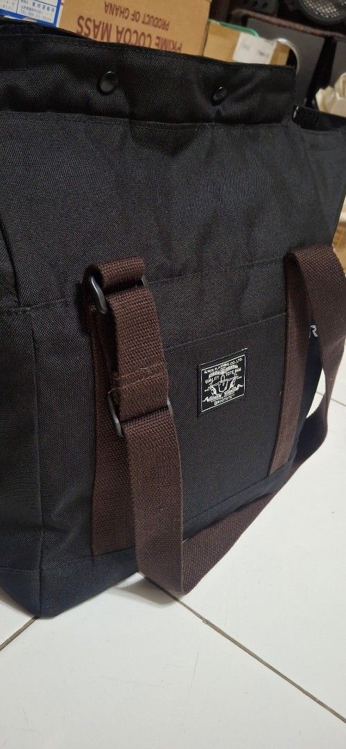 ROOTOTE Quality Tote Bag (Category: Tote Bags) located in Manila. Submitted by youngcloud_b1fffa (Listing ID 1447659650, Image 3). Description: - Black ROOTOTE tote bag - Made by Super Planning Co., Ltd. - Durable material, ideal for everyday use - Features brown straps - Includes practical pockets - Clean and versatile design - Please check photos for detailed condition "R&B Mix Japan Surplus Items".