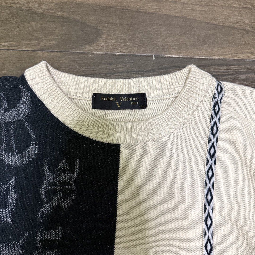Rudolph Valentino Sweater - Size LL (Category: Luxury Apparel) located in Alaminos. Submitted by khryssdeoc41715 (Listing ID 1447606066, Image 2). Description: - Rudolph Valentino sweater - Unique color block design in cream and dark navy - Features text and graphic details - Size LL - A stylish addition to any wardrobe.