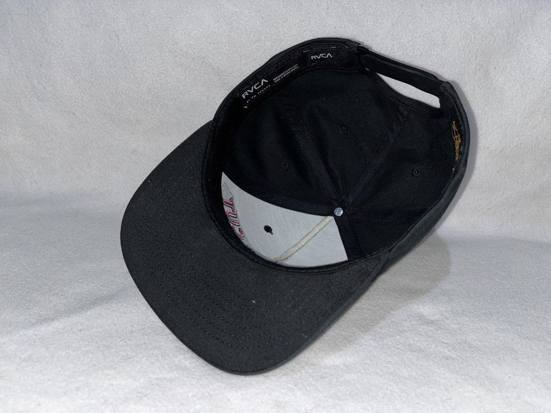 RVCA Black Snapback Cap "Fresh Cut" Embroidery (Category: Caps & Hats) located in Alfonso Lista (Potia). Submitted by saintmarysthrift (Listing ID 1447596577, Image 2). Description: - Black RVCA snapback cap - "Fresh Cut" embroidered on front (red & blue) - Adjustable snap closure at back - RVCA logo on back strap - Perfect for everyday wear.