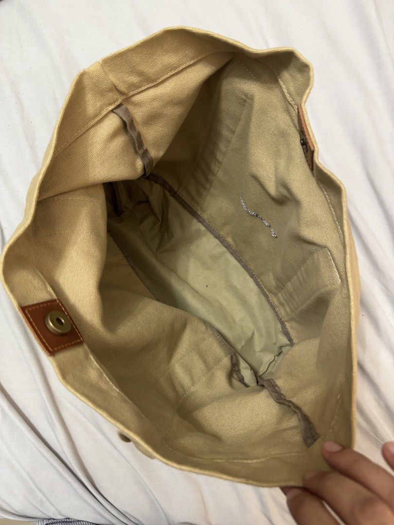 SADDLE ROW Canvas Tote Bag with Bicycle & Oars Graphic (Category: Tote Bags) located in Mandaluyong City. Submitted by ljcasinnn (Listing ID 1447642911, Image 3). Description: - Saddle Row Tan canvas tote bag - Features 'SEALIGN RIDE. ROW. REALIGN 2015' graphic with bicycle and oars - measurement in inches - Leather accents on handles - Interior pocket - Ideal for everyday use or as a beach bag.
