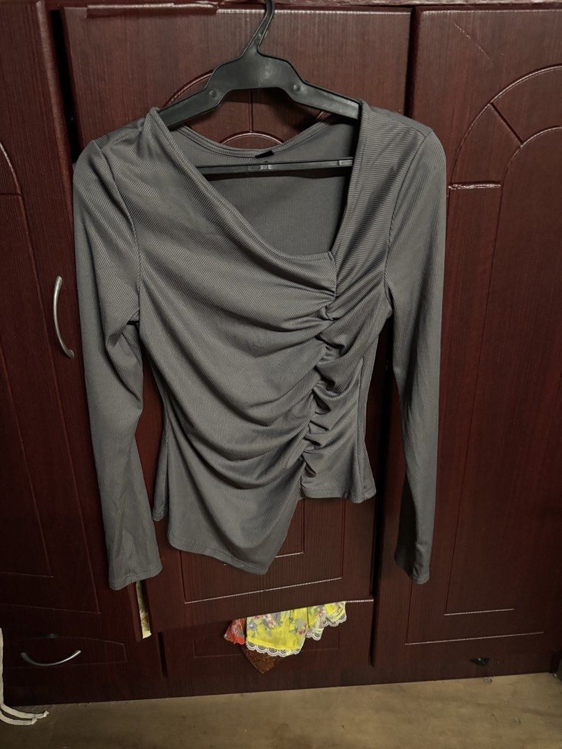 SHEIN Ruched Asymmetrical Neck Long Sleeve Top (Category: Longsleeves) located in Makati City. Submitted by clutterfairie (Listing ID 1447588532, Image 1). Description: - Long sleeve top - Ruched detailing on the side - Asymmetrical neckline - Stretchy and comfortable material - Perfect for dressing up or down - Available colors: Grey, Black, White.
