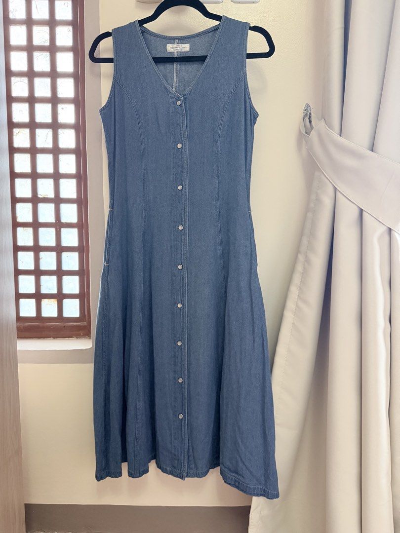 Sleeveless Denim Button-Front Midi Dress (Category: Dresses) located in Cebu City. Submitted by TheSunshineShop (Listing ID 1447514602, Image 1). Description: - Classic blue denim fabric - Sleeveless V-neck design - Full button-front closure - Flattering A-line midi skirt - Convenient side pockets - Versatile for casual outfits or layering.