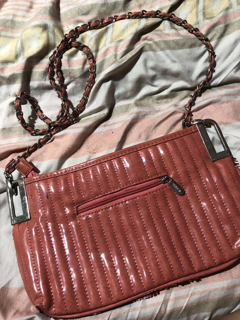Sparkly Rose Gold Shoulder Bag with Chain Strap (Category: Shoulder Bags) located in Manila. Submitted by bakithrift213 (Listing ID 1447630235, Image 3). Description: - Cute sparkly rose gold shoulder bag - Features a chain strap with faux leather detail - Quilted faux leather material on the back - Secure zipper closure - Ideal for nights out or adding glam to any outfit - Approximate dimensions: 9 inches wide x 5 inches tall.