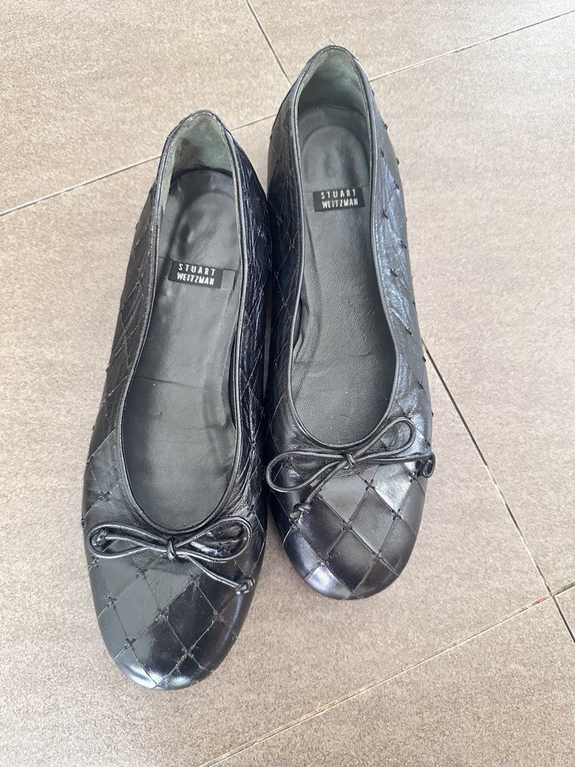 Stuart Weitzman Black Quilted Leather Ballet Flats (Category: Flats & Sandals) located in Tabuk. Submitted by classicseconds (Listing ID 1447552881, Image 1). Description: - Brand: Stuart Weitzman - Style: Ballet Flats - Material: Quilted Leather - Color: Black - Features: Small bow detail on toe - Condition: Soles show some wear - Design: Comfortable and classic.