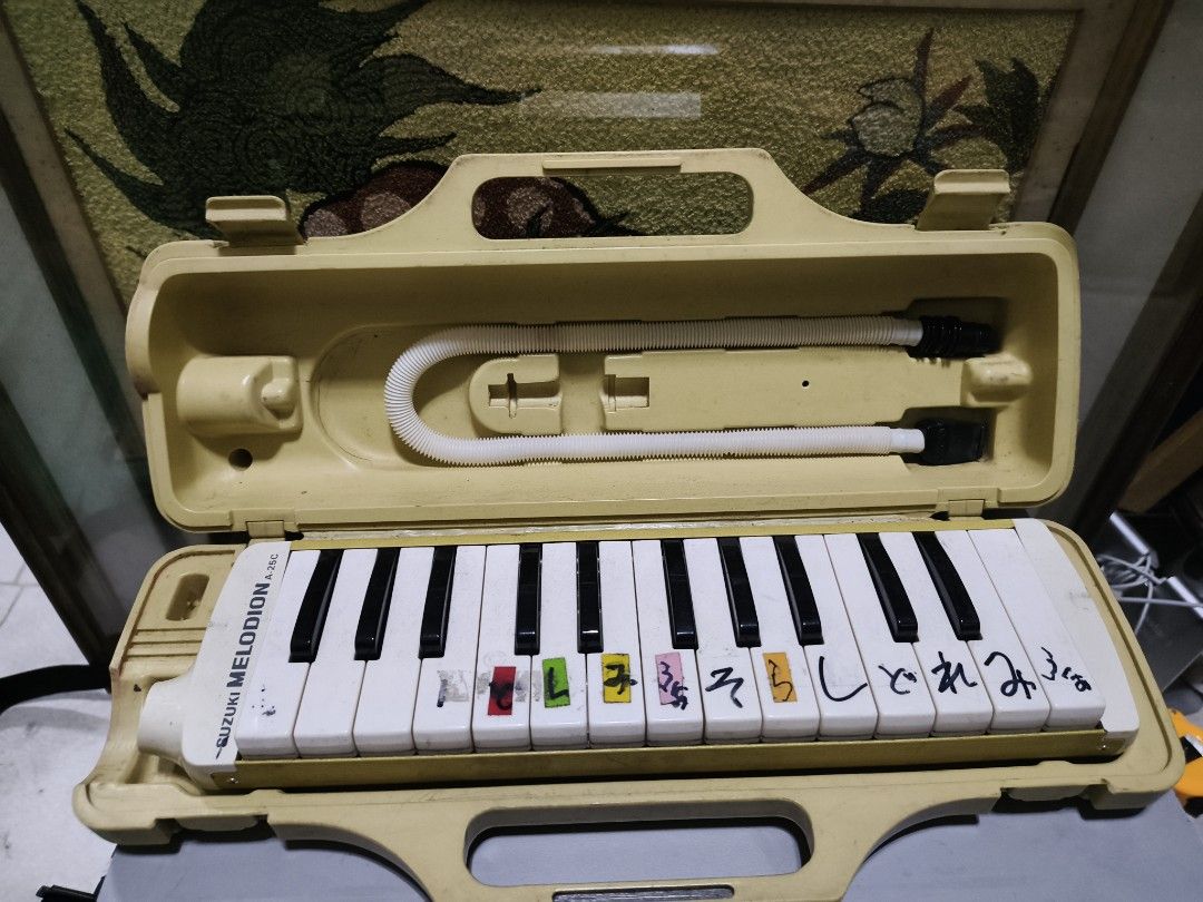 Suzuki Melodion Melodion Melodica with Case (Category: Musical Instruments) located in Manila. Submitted by reascheyss51406 (Listing ID 1447592505, Image 2). Description: - Suzuki Melodion - Comes with hard case and mouthpiece - Features some Japanese writing on the keys - Ideal for music learners - Pre-loved and ready for a new owner.
