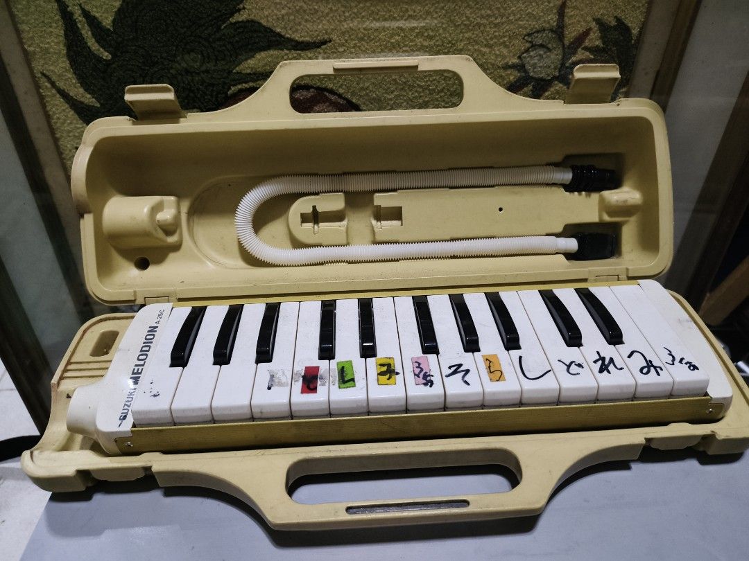 Suzuki Melodion Melodion Melodica with Case (Category: Musical Instruments) located in Manila. Submitted by reascheyss51406 (Listing ID 1447592505, Image 1). Description: - Suzuki Melodion - Comes with hard case and mouthpiece - Features some Japanese writing on the keys - Ideal for music learners - Pre-loved and ready for a new owner.