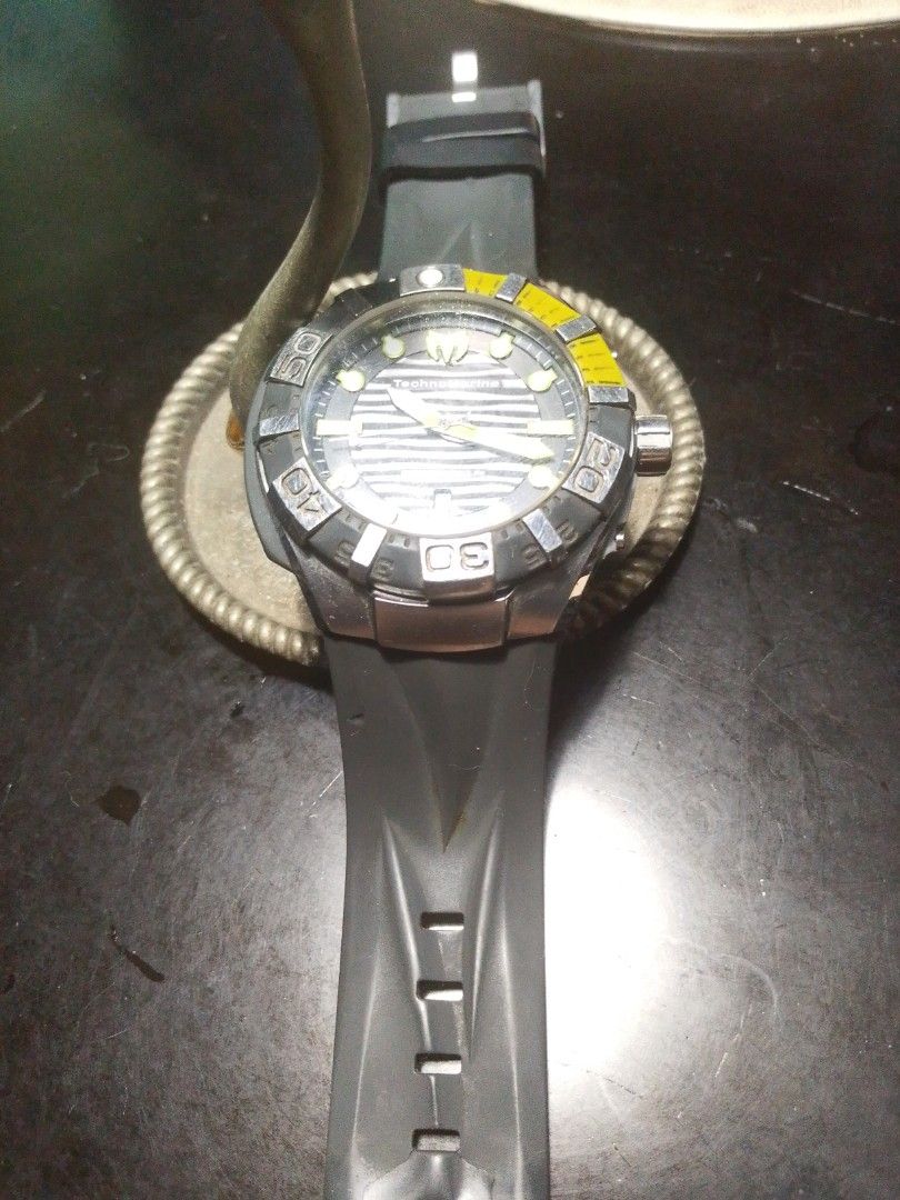 TechnoMarine Dive Watch (Category: Men's Watches) located in Santa Rosa. Submitted by strangelove10222 (Listing ID 1447672918, Image 1). Description: - Technomarine Men's Watch - BLACKREEF STRAP GREY & GREEN - Black rubber strap with silver buckle - Rotating bezel with yellow accents - Water resistant (great for swimming and diving) - Adjustable strap - Striped watch face pattern - Date - with box - Rush Bought at Technomarine Greenbelt 35k.