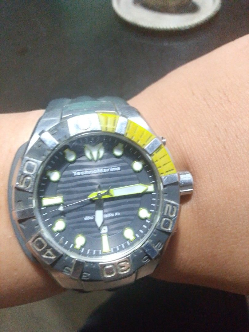 TechnoMarine Dive Watch (Category: Men's Watches) located in Santa Rosa. Submitted by strangelove10222 (Listing ID 1447672918, Image 2). Description: - Technomarine Men's Watch - BLACKREEF STRAP GREY & GREEN - Black rubber strap with silver buckle - Rotating bezel with yellow accents - Water resistant (great for swimming and diving) - Adjustable strap - Striped watch face pattern - Date - with box - Rush Bought at Technomarine Greenbelt 35k.