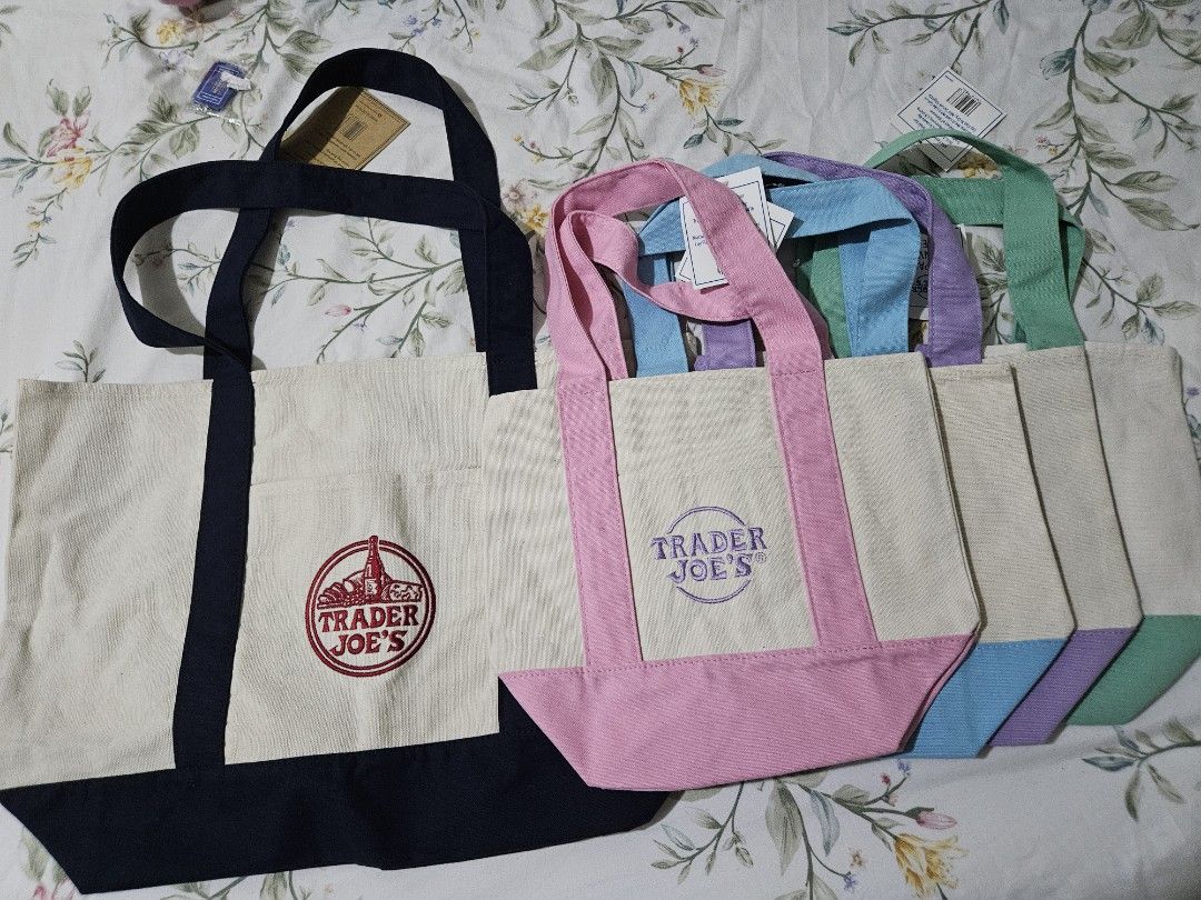 Trader Joe's Canvas Tote bags! GUARANTEED AUTH (Category: Tote Bags) located in Quezon City. Submitted by all200andbelow (Listing ID 1447581221, Image 2). Description: - Trader Joe's canvas tote bags - Available colors: Navy blue (large, red logo) Easter edition: Pink, Purple, Light Blue, Green (mini) - Ideal for groceries and everyday use - Made with sturdy canvas material.