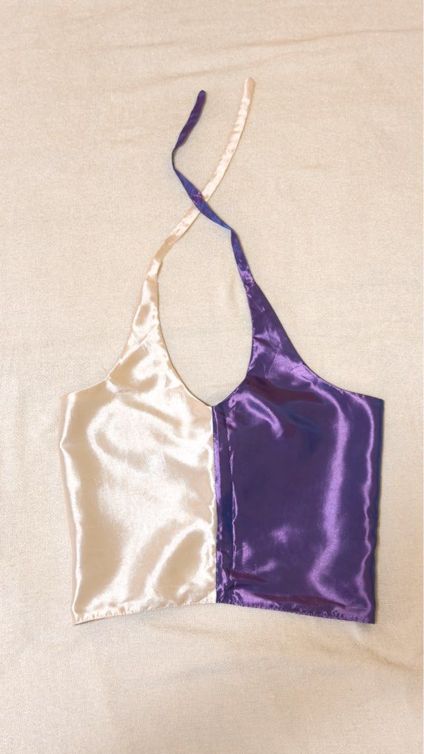 Two-Tone Satin Halter Top with Tie Back (Category: Sleeveless) located in Iloilo. Submitted by hellodindi (Listing ID 1447665670, Image 1). Description: - Unique cream and purple color block satin halter top. - Ties at the back for a customizable, adjustable fit. - Lightweight and flowy material. - Ideal for a night out or a special occasion..