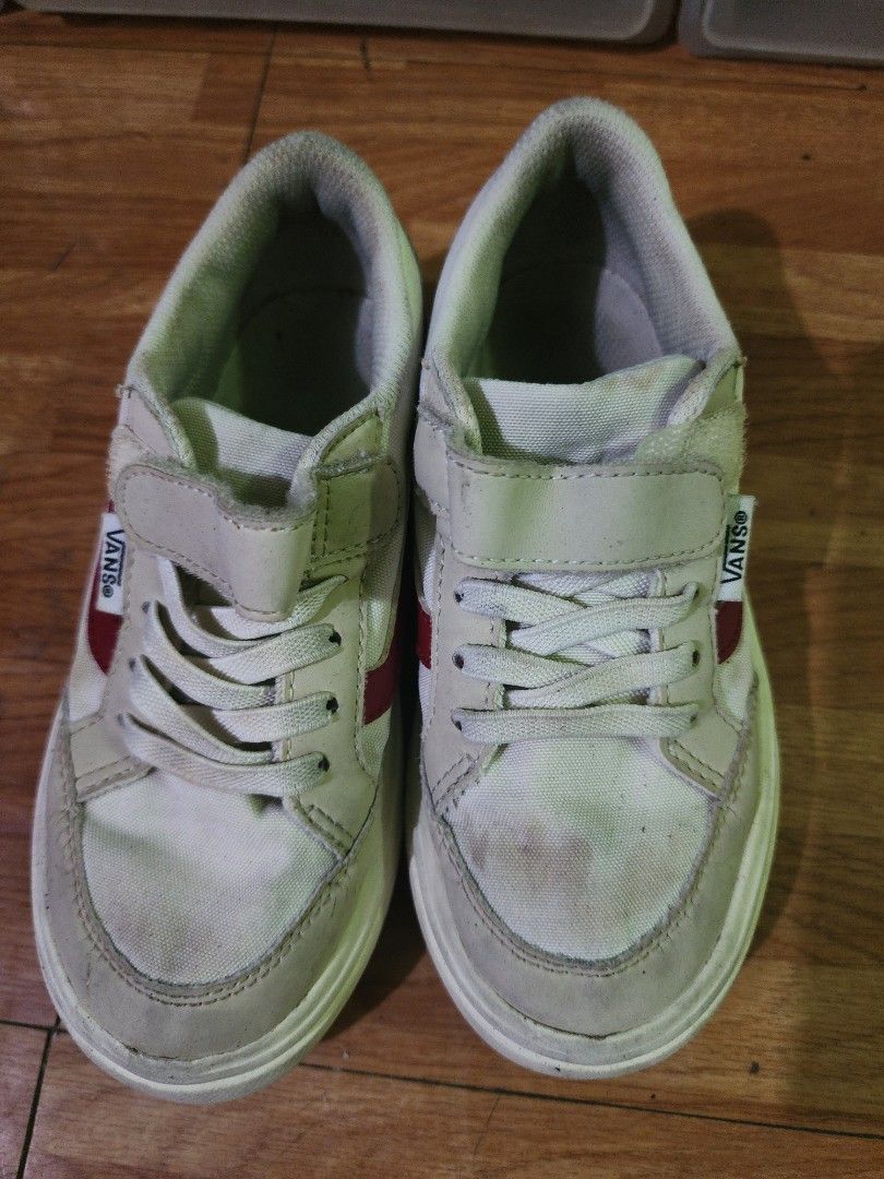 Vans Kids Shoes Size 19CM (Category: Babies & Kids Fashion) located in Imus. Submitted by momsiereyz (Listing ID 1447653036, Image 1). Description: - Kids Vans Shoes - Color: White and Beige with Red Stripe detail - Closure: Velcro strap and laces - Size: 19Cm - Condition: Some signs of wear (please check photos for details) - Ideal for: Everyday wear.