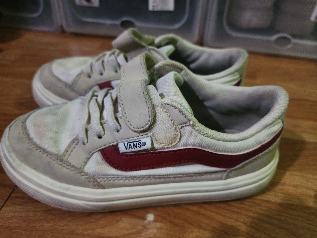 Vans Kids Shoes Size 19CM (Category: Babies & Kids Fashion) located in Imus. Submitted by momsiereyz (Listing ID 1447653036, Image 2). Description: - Kids Vans Shoes - Color: White and Beige with Red Stripe detail - Closure: Velcro strap and laces - Size: 19Cm - Condition: Some signs of wear (please check photos for details) - Ideal for: Everyday wear.