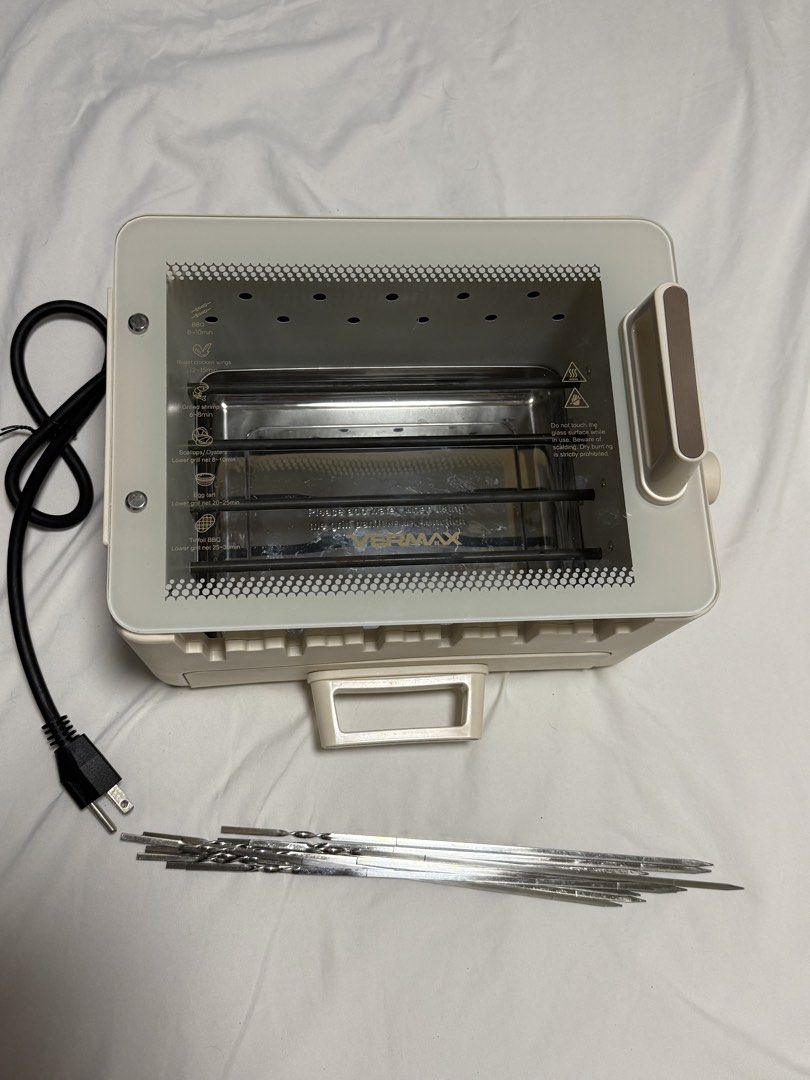 Vermax 2 Layer Multifunctional Skewer Maker Electric Grill (Category: Cookware & Accessories) located in Manila. Submitted by doodlessss (Listing ID 1447523974, Image 2). Description: Vermax 2 Layer Multifunctional Skewer Maker Electric Grill - Lightly Used - Originally bought from online store (SRP 2,975) - RFS: decluttering - 4-in-1 Grill & Hotpot Combo - Compact & Smokeless Design - 360 Rotating Grill - Color: White - Power: 800 Watts - Voltag