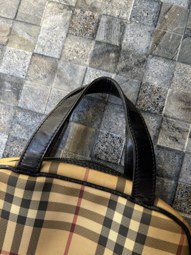 Vintage Burberry Nova Check top-handle handbag (Category: Luxury Bags & Wallets) located in Quezon City. Submitted by commonwealthpickerph (Listing ID 1447537546, Image 3). Description: Vintage Burberry Nova Check top-handle handbag - 12 width // 8 length - Features black leather trim and handles. - Secure zipper closure. - Handles show some signs of wear. - Ideal for everyday use. - In good condition - Has sign of used and age - check pic to see