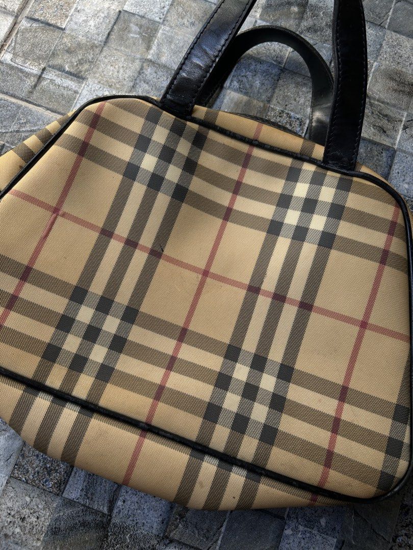 Vintage Burberry Nova Check top-handle handbag (Category: Luxury Bags & Wallets) located in Quezon City. Submitted by commonwealthpickerph (Listing ID 1447537546, Image 2). Description: Vintage Burberry Nova Check top-handle handbag - 12 width // 8 length - Features black leather trim and handles. - Secure zipper closure. - Handles show some signs of wear. - Ideal for everyday use. - In good condition - Has sign of used and age - check pic to see