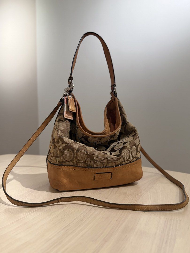 Vintage Coach 2-Way Signature Small Hobo (2156) (Category: Bags & Wallets) located in Kuala Lumpur. Submitted by shopfoundandloved (Listing ID 1447635299, Image 1). Description: The ultimate Y2K grail piece. Effortlessly converts from a slouchy underarm shoulder bag to a casual-cool crossbody using the long strap. The Style: 2-Way Slouchy Hobo / Crossbody Bag Material: Signature Monogram Canvas + Suede base + genuine tan leather trim Style No: 21
