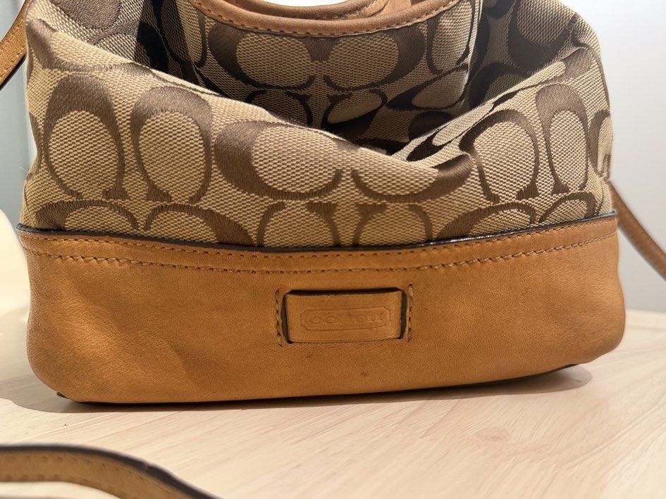 Vintage Coach 2-Way Signature Small Hobo (2156) (Category: Bags & Wallets) located in Kuala Lumpur. Submitted by shopfoundandloved (Listing ID 1447635299, Image 3). Description: The ultimate Y2K grail piece. Effortlessly converts from a slouchy underarm shoulder bag to a casual-cool crossbody using the long strap. The Style: 2-Way Slouchy Hobo / Crossbody Bag Material: Signature Monogram Canvas + Suede base + genuine tan leather trim Style No: 21