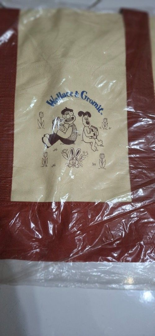 Wallace & Gromit Canvas Tote Bag (Category: Tote Bags) located in Manila. Submitted by youngcloud_b1fffa (Listing ID 1447667863, Image 1). Description: - Adorable Wallace & Gromit canvas tote bag - Classic cream color with stylish brown trim and handles - Ideal for everyday use, groceries, or as a fun accessory - Spacious interior for all your essentials - Brand new, still in original packaging "R&B Mix Japan Surplus Items".