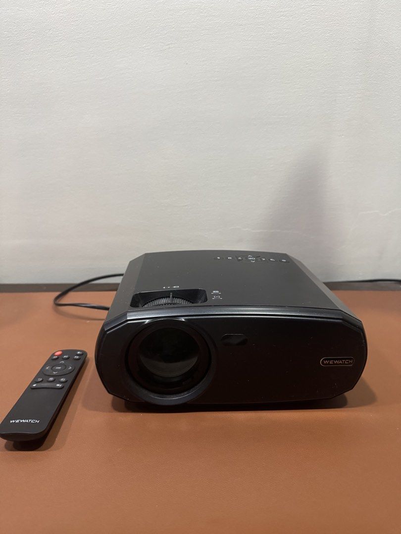 WEWATCH V50 Projector with Remote (Category: Projectors) located in Manila. Submitted by kuroshirooreo (Listing ID 1447569833, Image 1). Description: - WEWATCH, LCD projector - Includes remote control, a bit noisy when using but manageable - Connectivity: SD card slot, HDMI, USB, VGA - Ideal for movie nights and presentations - In excellent working condition.