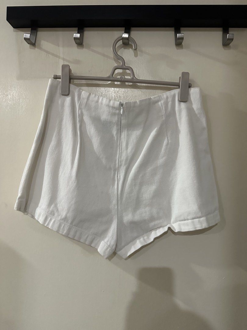 White Denim Skort with Wrap Front (Category: Shorts) located in Manila. Submitted by bellevd (Listing ID 1447549117, Image 2). Description: - White denim skort - Trendy wrap-around front design - Secure back zipper closure - Comfortable and stylish for daily wear - Ideal for casual outings or dressing up.