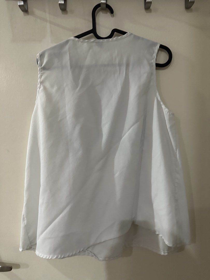 White Embroidered Cold Shoulder Top (Category: Blouses) located in Manila. Submitted by bellevd (Listing ID 1447547935, Image 2). Description: - White sleeveless top - Colorful embroidered neckline detail - Cold shoulder design - Flowy, lightweight fabric - Versatile: great for casual wear or beach cover-up - Easy to pair with jeans or shorts.