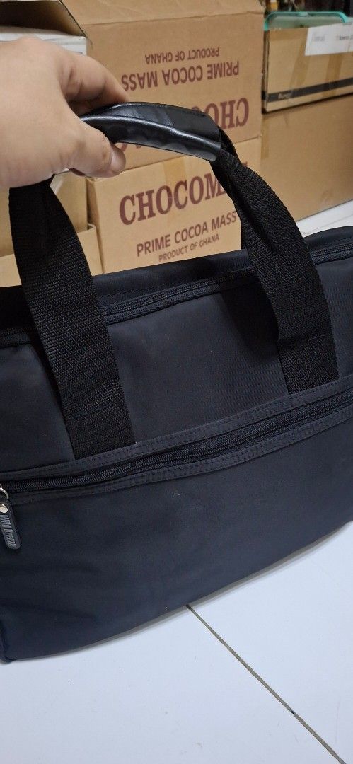 Wild Breeze Black Laptop Bag (Category: Laptop Bags & Sleeves) located in Manila. Submitted by youngcloud_b1fffa (Listing ID 1447667764, Image 1). Description: - Brand: Wild Breeze - Color: Black - Features: Main compartment, front zip pocket - Handles: Sturdy with leather accents - Strap: Detachable shoulder strap - Ideal for: Work or travel - Capacity: Plenty of space inside "R&B Mix Japan Surplus Items".
