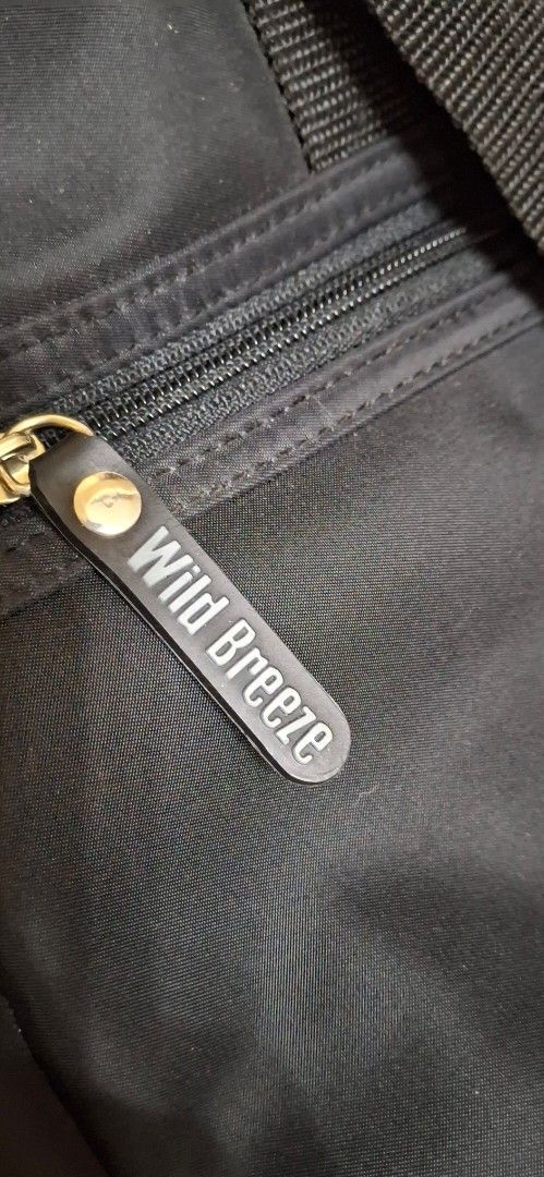 Wild Breeze Black Laptop Bag (Category: Laptop Bags & Sleeves) located in Manila. Submitted by youngcloud_b1fffa (Listing ID 1447667764, Image 3). Description: - Brand: Wild Breeze - Color: Black - Features: Main compartment, front zip pocket - Handles: Sturdy with leather accents - Strap: Detachable shoulder strap - Ideal for: Work or travel - Capacity: Plenty of space inside "R&B Mix Japan Surplus Items".