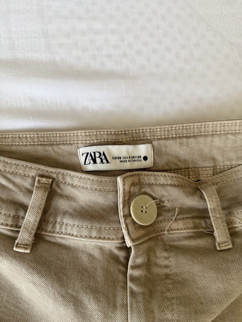 Zara Beige Wide Leg Cropped Pants (Category: Other Bottoms) located in Manila. Submitted by ella1222 (Listing ID 1447572698, Image 2). Description: - Zara beige pants - Wide leg and cropped style - Raw hem detail - Made in Tunisia - Size: EUR 38, USA 4, MEX 26 - Ideal for casual wear.