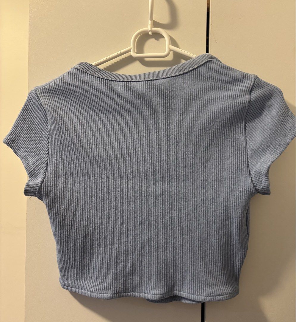 ZARA Ribbed Cropped Top with Buttons - Blue (Category: Blouses) located in Makati City. Submitted by shariesg (Listing ID 1447520415, Image 3). Description: - ZARA Blue Ribbed Cropped Top - Size: Medium (M) - Style: Short sleeves, scoop neckline with button details - Condition: Brand new with tags attached - Perfect for: Casual wear or dressing up.