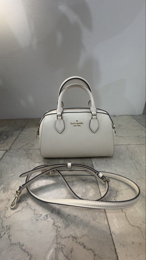 💯 AUTHENTIC Kate Spade Madison Duffle Bag (Category: Luxury Bags & Wallets) located in Manila. Submitted by eun1127 (Listing ID 1447793184, Image 1). Description: 💯 AUTHENTIC Kate Spade Madison Duffle Bag / with sling Rarely Used - In Good Condition Feel free to ask for photos for authentication purposes. RFS: Decluttering/ too many bags Price slightly negotiable 😊 .