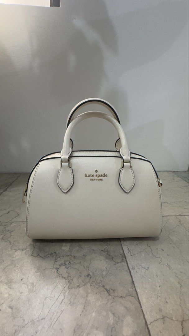 💯 AUTHENTIC Kate Spade Madison Duffle Bag (Category: Luxury Bags & Wallets) located in Manila. Submitted by eun1127 (Listing ID 1447793184, Image 2). Description: 💯 AUTHENTIC Kate Spade Madison Duffle Bag / with sling Rarely Used - In Good Condition Feel free to ask for photos for authentication purposes. RFS: Decluttering/ too many bags Price slightly negotiable 😊 .