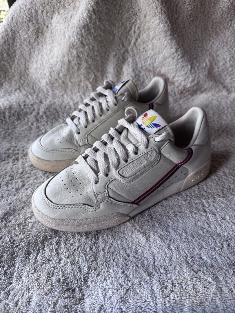 Adidas Continental 80 Rainbow Stripe Sneakers (Category: Sneakers) located in Antipolo. Submitted by kitclothing (Listing ID 1447822868, Image 1). Description: - Adidas Continental 80 sneakers - Classic white leather upper - Iconic rainbow stripes on side and heel - White laces - Soles show minor wear, still good grip - Ideal for casual wear - NO HAGGLING, FREE SHIPPING ONLY.