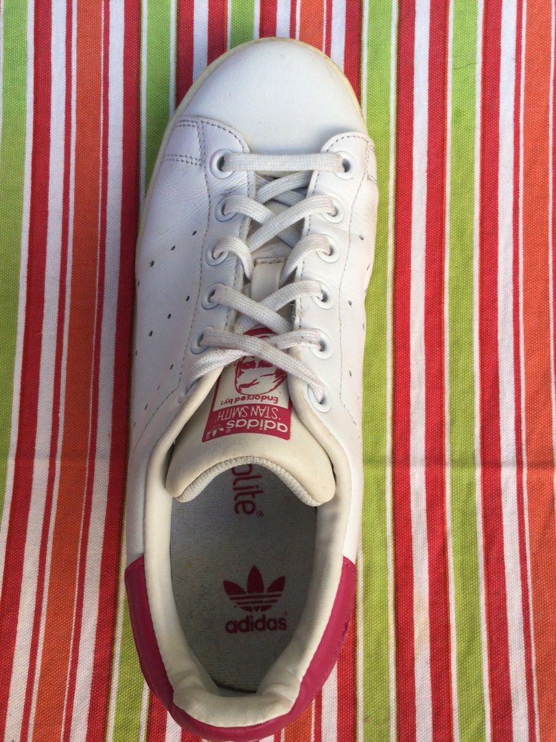 Adidas Stan Smith White Red Leather Sneakers (Category: Sneakers) located in Los Banos. Submitted by bingo1962 (Listing ID 1447773838, Image 3). Description: Classic Adidas Stan Smith sneakers. White leather with red accents on the heel and tongue. Perforated stripes on the sides. Laces are white. These are a staple for any casual outfit. Great for everyday wear..