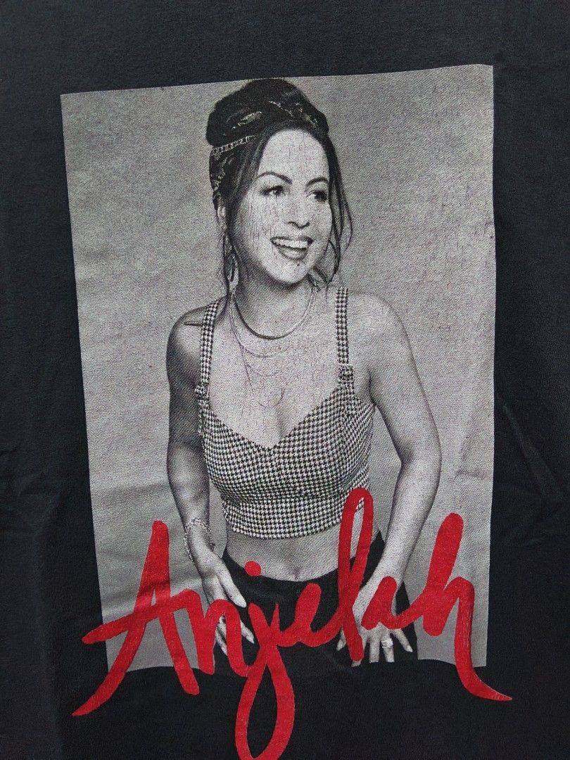 Anjelah Johnson (Bon Qui Qui) (Category: Tshirts & Polo Shirts ) located in Taguig. Submitted by wethrifting2021 (Listing ID 1447703361, Image 2). Description: Item: Anjelah Johnson (Bon Qui Qui)🔥 ‎Size: OPT Anjelah . Com and Cut Tag (M) ‎Width: 20 ‎Length: 27.5 ‎Condition: Excellent ‎Issue: Stain, Hairline SWIPE MORE DETAILS. DM to purchase 📩.