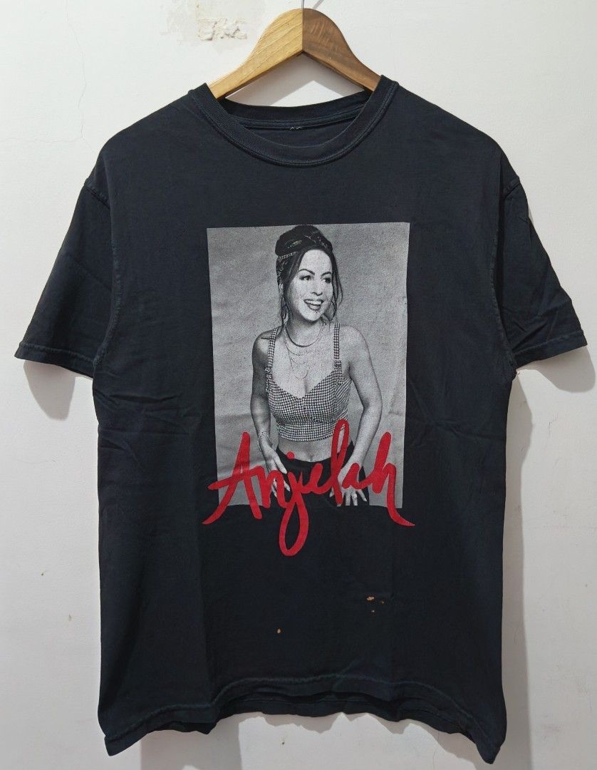Anjelah Johnson (Bon Qui Qui) (Category: Tshirts & Polo Shirts ) located in Taguig. Submitted by wethrifting2021 (Listing ID 1447703361, Image 1). Description: Item: Anjelah Johnson (Bon Qui Qui)🔥 ‎Size: OPT Anjelah . Com and Cut Tag (M) ‎Width: 20 ‎Length: 27.5 ‎Condition: Excellent ‎Issue: Stain, Hairline SWIPE MORE DETAILS. DM to purchase 📩.