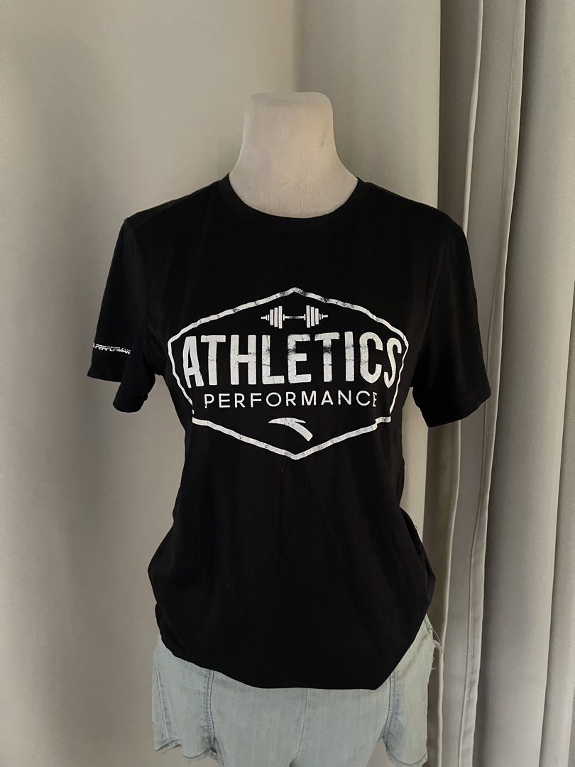 ANTA Black Athletics Performance T-shirt (Category: Shirts) located in Cainta. Submitted by zlove111 (Listing ID 1447753048, Image 1). Description: - Brand: ANTA - Color: Black (front), Navy Blue (back) - Graphic: 'Athletics Performance' with distressed effect on front - Detail: Small ANTA logo on sleeve - Back: Plain navy blue - Ideal for: Workouts, gym sessions, casual wear.