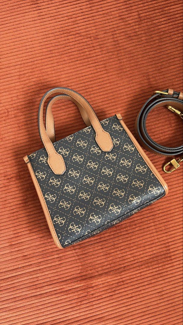 Authentic Guess bag with sling (Category: Purses & Pouches) located in Cavite. Submitted by helpdeclutterthisgirl (Listing ID 1447778308, Image 2). Description: used once lang di nagagamit guaranteed authentic money back if fake.
