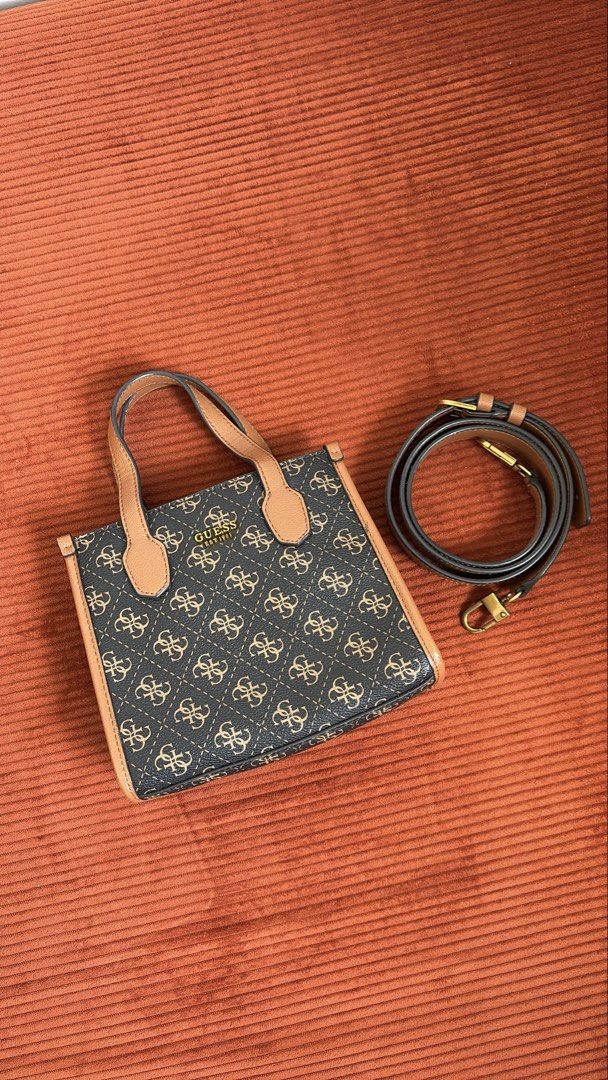 Authentic Guess bag with sling (Category: Purses & Pouches) located in Cavite. Submitted by helpdeclutterthisgirl (Listing ID 1447778308, Image 1). Description: used once lang di nagagamit guaranteed authentic money back if fake.