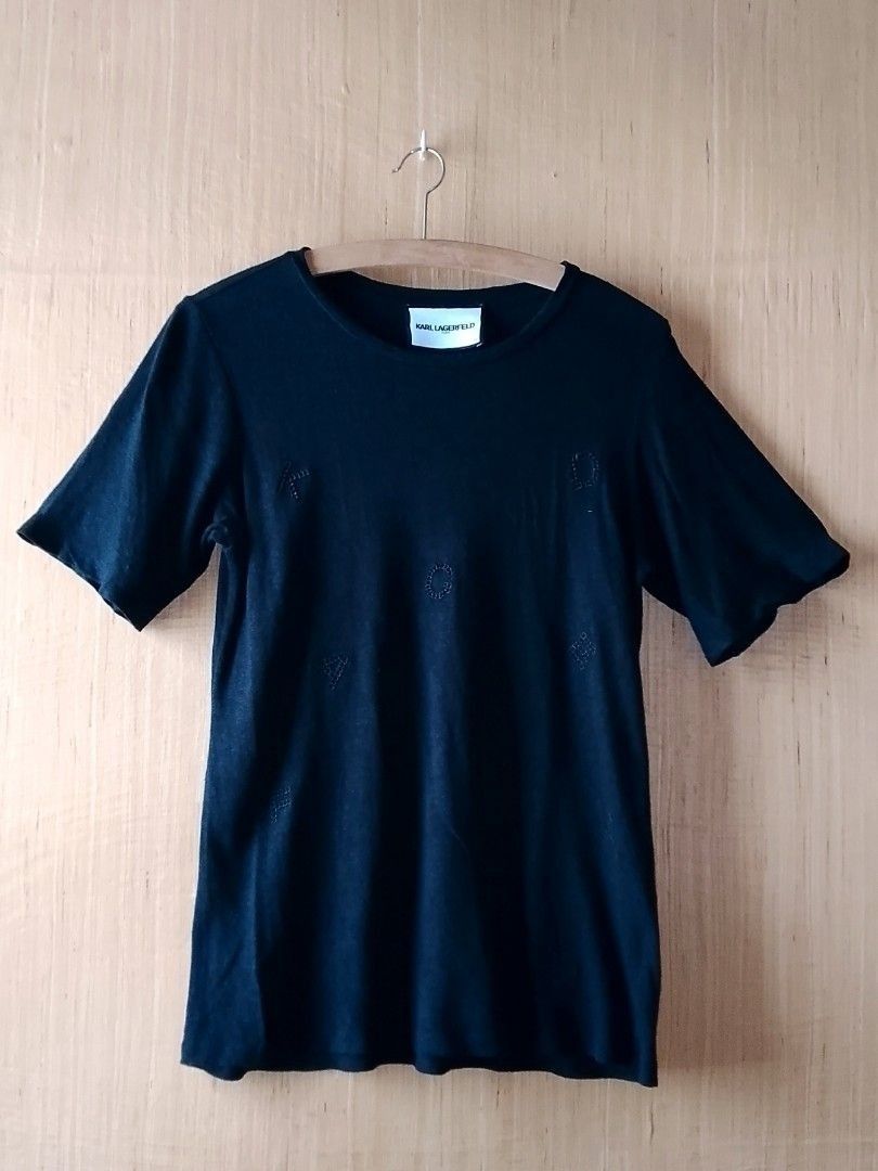 AUTHENTIC Karl Lagerfeld Women's Tee (Category: Shirts) located in Iloilo. Submitted by achinom (Listing ID 1447843086, Image 2). Description: AUTHENTIC Karl Lagerfeld Women's Tee Size SMALL Dimensions when laid flat: Chest/Bust (pit-to-pit) 18 inches (quite stretchable) Length 26 inches IN EXCELLENT USED CONDITION. NO rip, stains, or holes. Color BLACK Color rate 10/10 This black crew-neck shirt features subtle, tone-on-tone embroidered Karl Lag