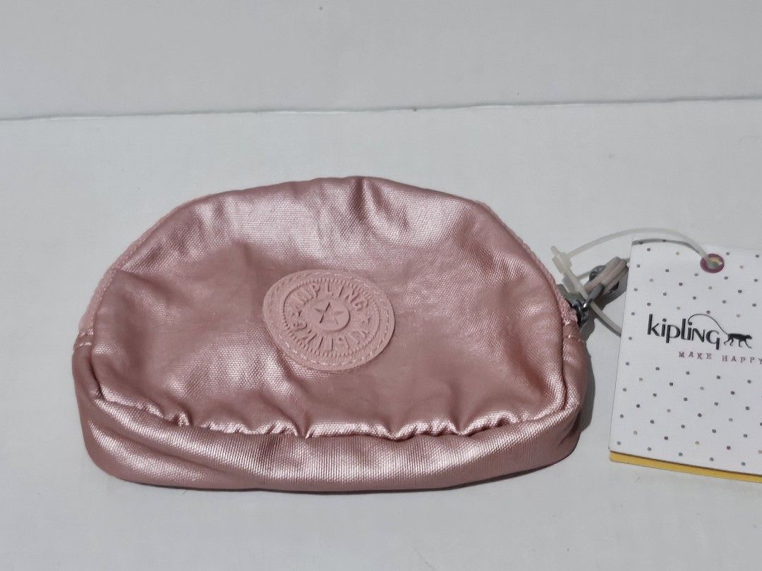Authentic Kipling Bunny Metallic Rose Gold Pouch/Coin Purse (Category: Purses & Pouches) located in Mandaluyong City. Submitted by coffeecatsph (Listing ID 1447808023, Image 1). Description: - Cute Kipling pouch - Shimmery rose gold metallic finish - Ideal for coins, cards, or small essentials - Features internal card slots - Secure zipper closure - Comes with original tag.