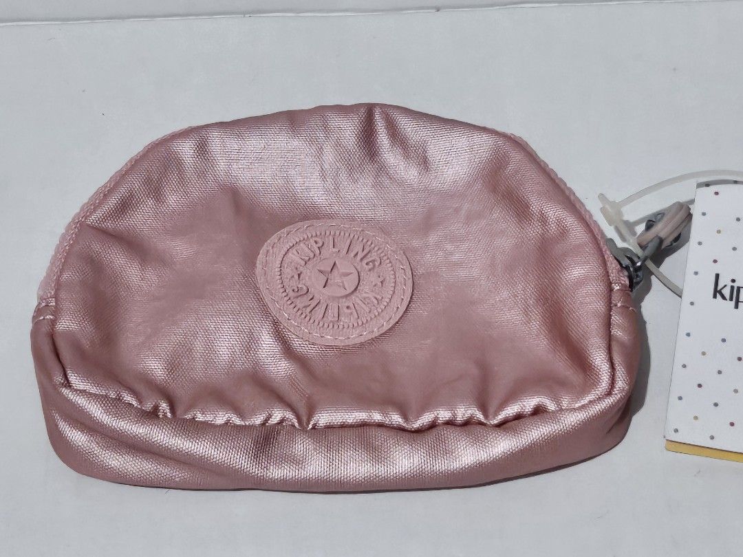 Authentic Kipling Bunny Metallic Rose Gold Pouch/Coin Purse (Category: Purses & Pouches) located in Mandaluyong City. Submitted by coffeecatsph (Listing ID 1447808023, Image 2). Description: - Cute Kipling pouch - Shimmery rose gold metallic finish - Ideal for coins, cards, or small essentials - Features internal card slots - Secure zipper closure - Comes with original tag.