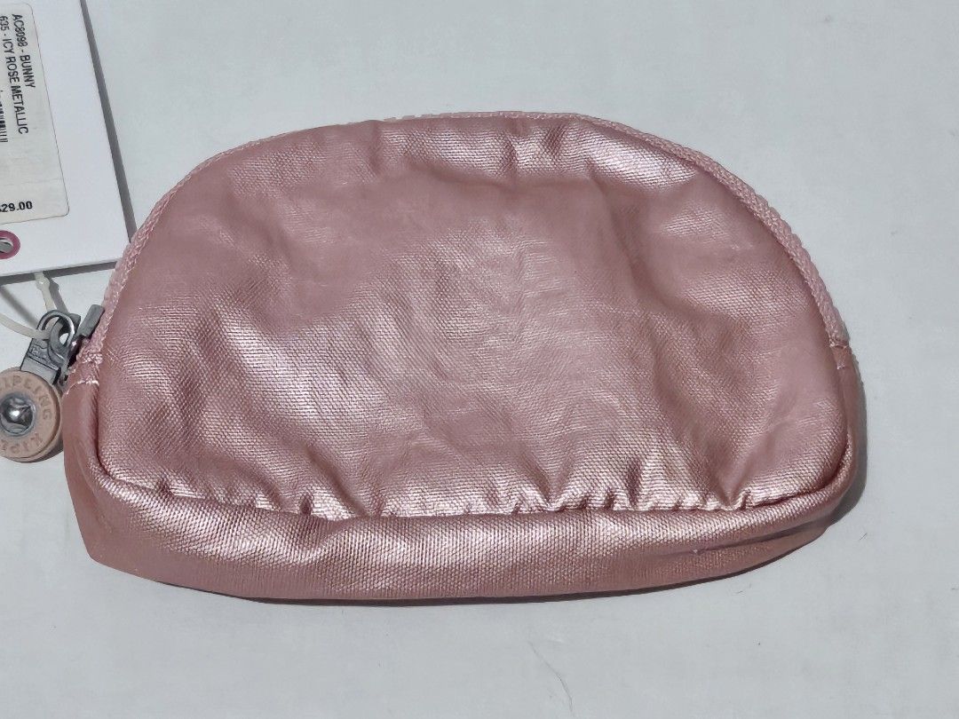 Authentic Kipling Bunny Metallic Rose Gold Pouch/Coin Purse (Category: Purses & Pouches) located in Mandaluyong City. Submitted by coffeecatsph (Listing ID 1447808023, Image 3). Description: - Cute Kipling pouch - Shimmery rose gold metallic finish - Ideal for coins, cards, or small essentials - Features internal card slots - Secure zipper closure - Comes with original tag.