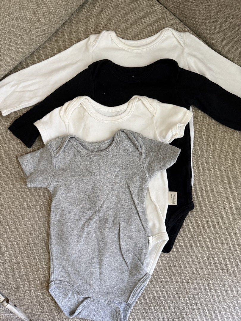 Baby Bodysuits - 4 Pack - 6-12mos (Category: Babies & Kids Fashion) located in Taguig. Submitted by dmtkph (Listing ID 1447825760, Image 1). Description: - Set of 4 baby bodysuits - Includes: 1 grey short-sleeve, 1 black long-sleeve, 2 white long-sleeve - Soft and comfortable fabric - Ideal for everyday wear and layering - Essential baby clothing.