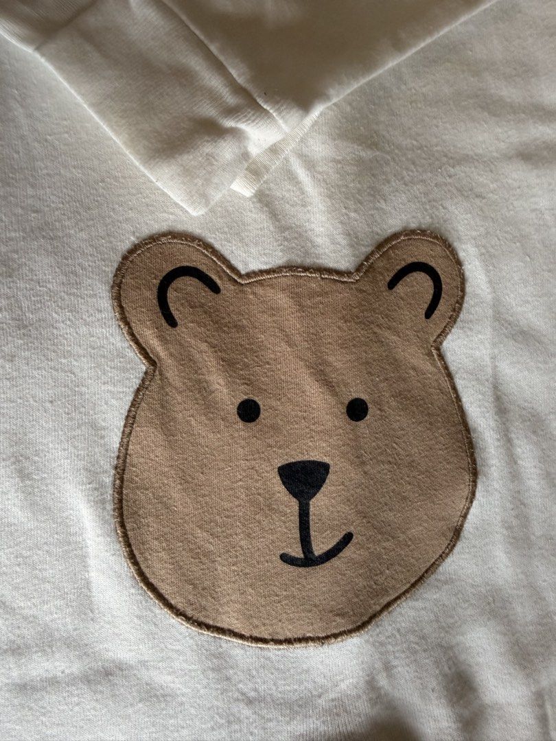 Baby Gap "First Favorites" Cream Bear Romper 6-12 Months (Category: Babies & Kids Fashion) located in Kuala Lumpur. Submitted by mayza.horse (Listing ID 1447750978, Image 1). Description: - Cream colored long-sleeved romper - Baby Gap brand - Cute bear applique on the front - Small embroidered bear logo near collar - Full button-down front for easy dressing - Made from soft cotton.