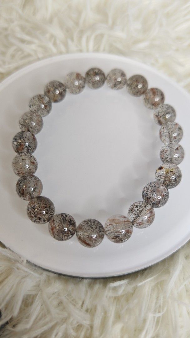Biotite Super 7 Bracelet (Category: Bracelets) located in Kuala Lumpur. Submitted by azicrystal (Listing ID 1447699603, Image 2). Description: - Stretch bracelet made with natural stones. - Each bead features unique inclusions and patterns. - Resembles quartz with subtle dark mineral specks. - Comfortable and easy to wear. - Perfect for elevating your everyday style. - wrist size 16cm - bead size 9mm.