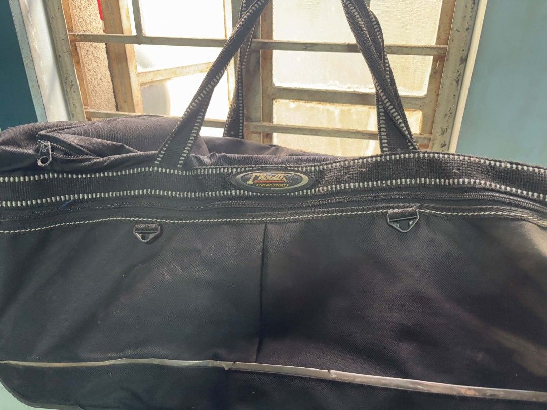 Black Duffle Bag with Wheels (Category: Luxury Bags & Wallets) located in Quezon City. Submitted by giveitalife (Listing ID 1447882389, Image 2). Description: - Black duffle bag - Features handles and wheels for easy transport - Ample interior space for all your essentials - Zippers are in good working condition - Shows minor scuffing on the bottom from normal use - Ideal for weekend getaways or overnight stay.