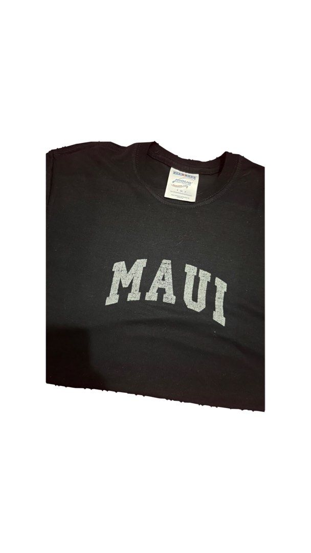 Black Maui T-shirt (Category: Tshirts & Polo Shirts ) located in Manila. Submitted by magsdraft (Listing ID 1447813264, Image 1). Description: - Black t-shirt with 'Maui' graphic print - Crew neck, short sleeves - Comfortable for everyday wear - Ideal for casual outings.